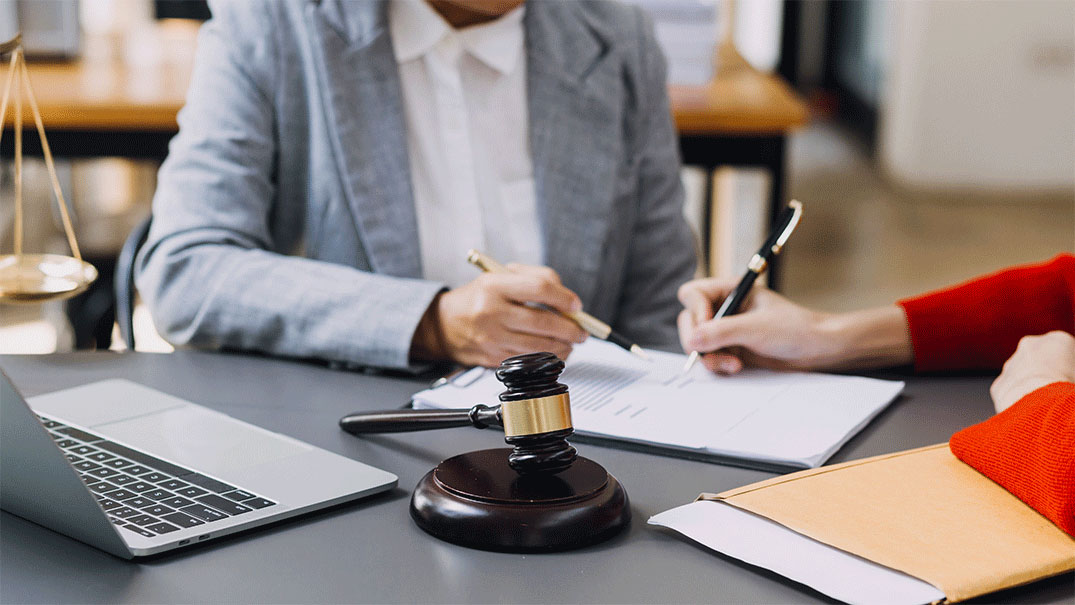 Two people working on a legal document