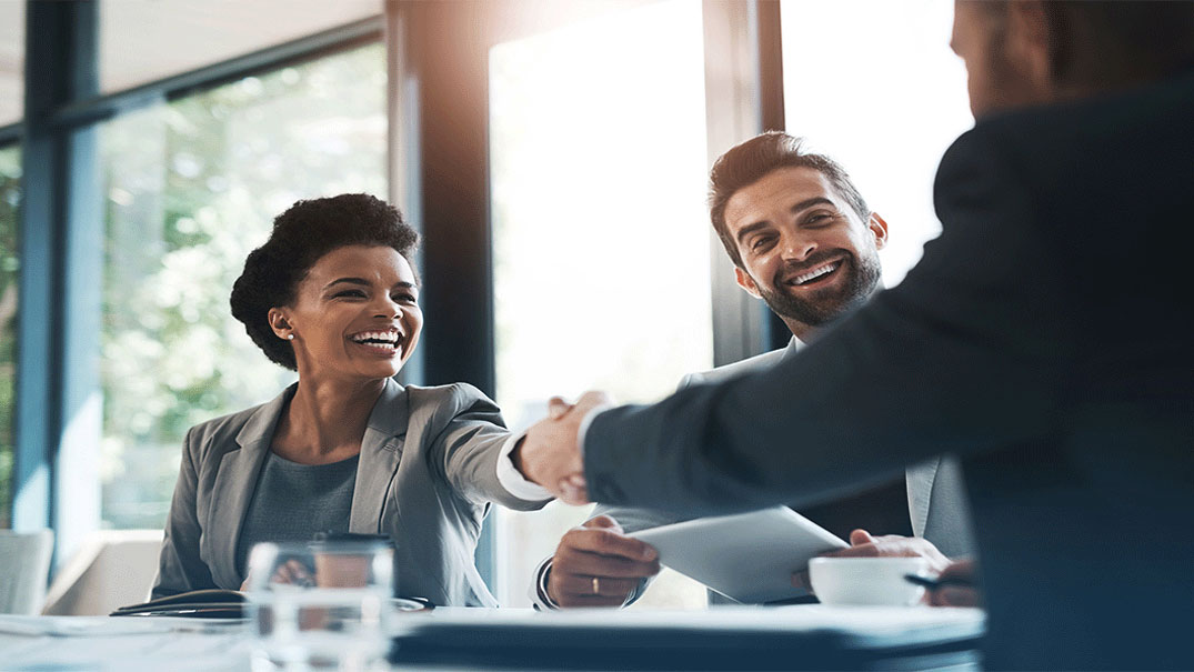 HR professional onboarding an employee in a workplace.