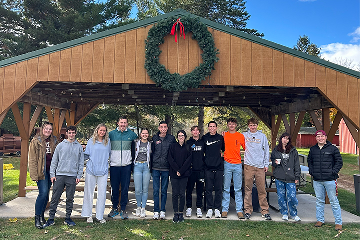 CMU business students get ready for community service activities at local park.